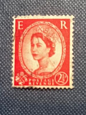 Queen Elizabeth II Red Postage Revenue Stamp 2s. A red and off-white postage stamp featuring a 