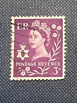 Northern Ireland Queen Elizabeth II 3D Postage Revenue Stamp. A single purple postage stamp from 