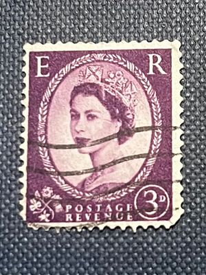 A Purple Queen Elizabeth II 'Wilding' 3D Postage Stamp. A purple/mauve postage stamp featuring a 