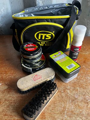 Workman’s toolbag with hard hat key ring. Contains shoe shine kit
