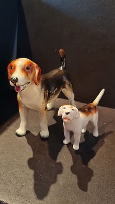 Two dogs one stamped Beswick. Two dogs both with repairs one 
Stamped beswick, the other stamp 