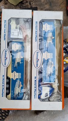 Two die cast trucks. Two boxed Brittany ferries 
Truck and trailer sets