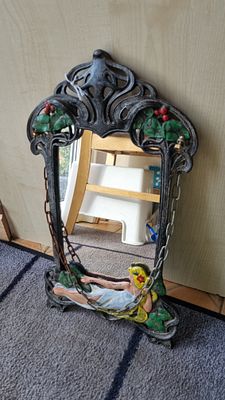 Cast iron ornate mirror. Beautiful cast iron mirror 
With hanging chain