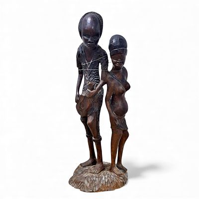 AFRICAN CRAFTS. Carved wooden statuette, signed Temb&eacute;. Dim: 85 cm. Notes: musician's arm loose.