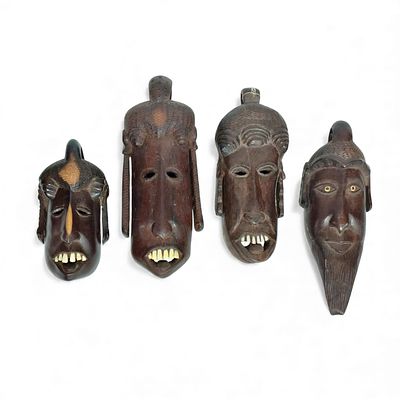 AFRICAN CRAFTS. Set of 4 wooden masks. Dim: 22 cm (tallest).