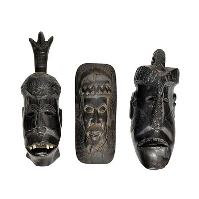AFRICAN HANDICRAFTS. Set composed of 3 masks carved in wood. Dim: 22 cm (largest).