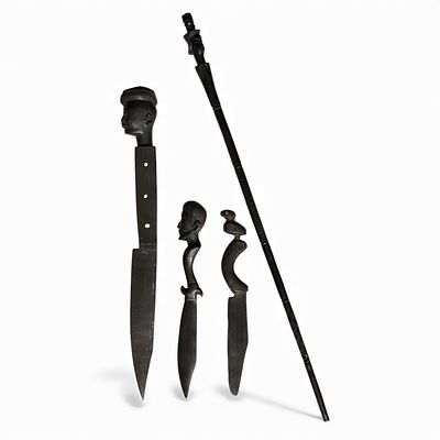 AFRICAN HANDICRAFTS. Set composed of 4 pieces carved in wood (3 knives and 1 staff). Dim: 48 cm 