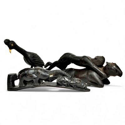 AFRICAN HANDICRAFTS. Set composed of 3 richly carved wooden statuettes. Dim: 28 cm (largest). 