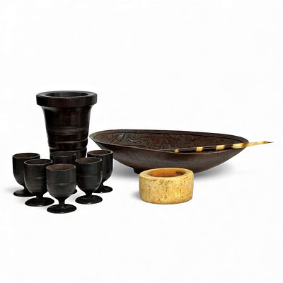 AFRICAN HANDICRAFTS. Set composed of 14 pieces carved in wood (1 bowl, 1 oval plate, 6 footed 