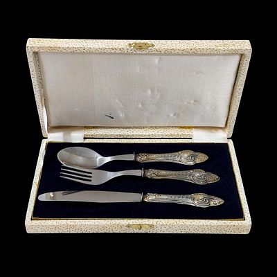SILVER. THREE SILVER CUTLERY PIECES - set of fork, knife, and spoon with handles crafted in 