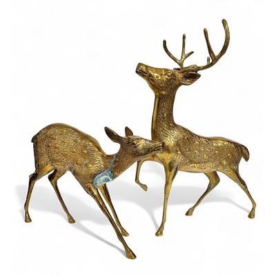 STATUETTES. Set composed of 2 gilded metal alloy deer. Dim: 44 cm (largest). Notes: defects.