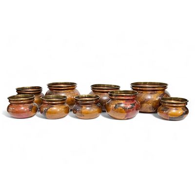 BRASS. Set composed of 9 brass flowerpots. Dim: 20 cm (largest).
