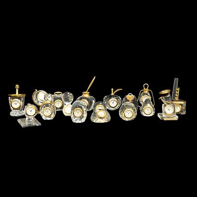 WATCHES. Collection of decorative display case watches consisting of 18 faceted glass watches. 