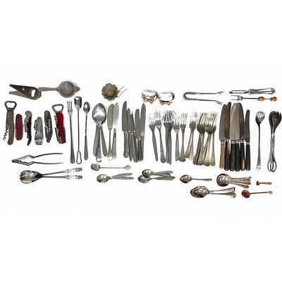 MISCELLANEOUS CUTLERY. Set with approximately 80 serving utensils, napkin rings, forks, knives 