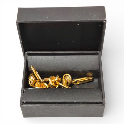 CUFFLINKS. Set of 2 pairs of used gold-tone metal cufflinks with interwoven and embossed designs 