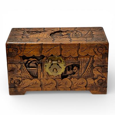 ORIENTAL CHEST. Oriental jewelry box made of Camphor wood, richly carved in bas-relief with 