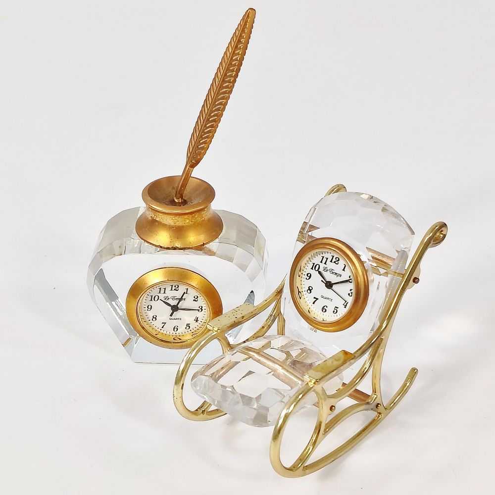 TABLE CLOCKS. Set of 2 table clocks in cut crystal and gilded metal, one in the shape of a 