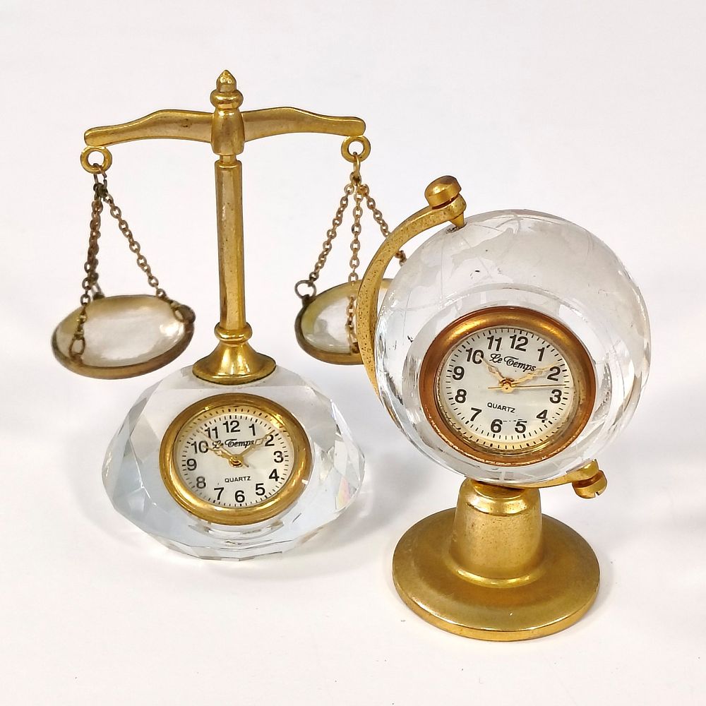 DESK CLOCKS. Set of 2 desk clocks in cut crystal and gilded metal, one in the shape of a globe 
