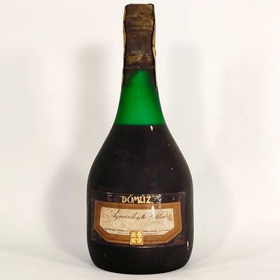 OLD BRANDY. Old D&oacute;m&uacute;z brandy bottle, a Portuguese product produced by Sociedade D&oacute;m&uacute;z.