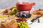 KUHN RIKON CLASSIC RED CHEESE FONDUE SET 2.6 L. Cheese fondue set with a 23 cm pot and 2.6-liter Image - 1
