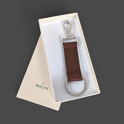 OFFICIAL ROLEX LEATHER KEYCHAIN. Luxury Rolex brand keychain in brown leather in the original 