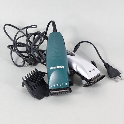 HAIR CLIPPERS BRAND "TAURUS AND MITHOS". Two professional hair cutting machines with clip-on 