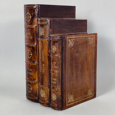 BOOK-SHAPED HIDING BOX. Wooden hiding box with a door shaped like old books with faux leather 
