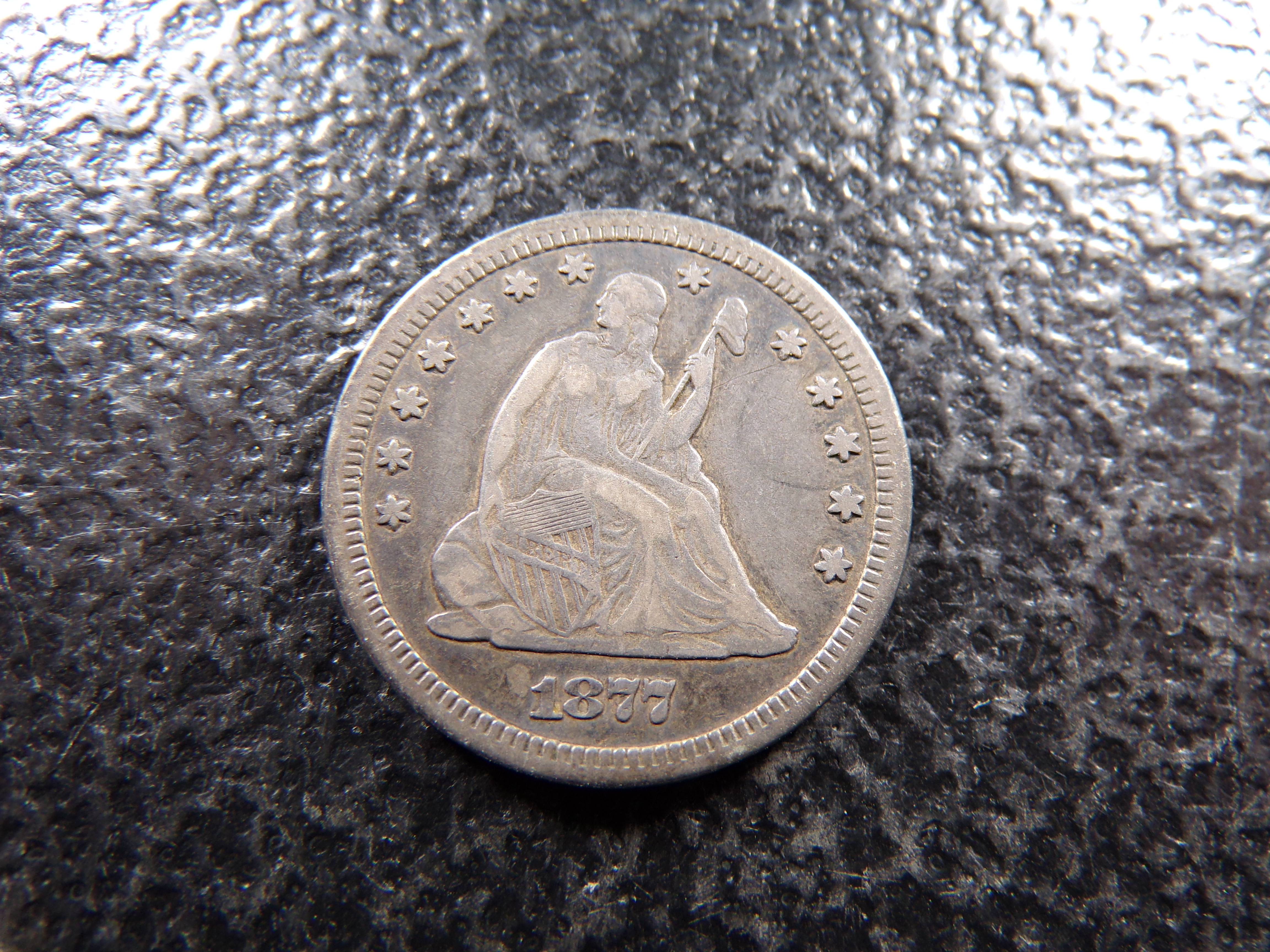 1877-CC CARSON CITY SEATED LIBERTY SILVER QUARTER