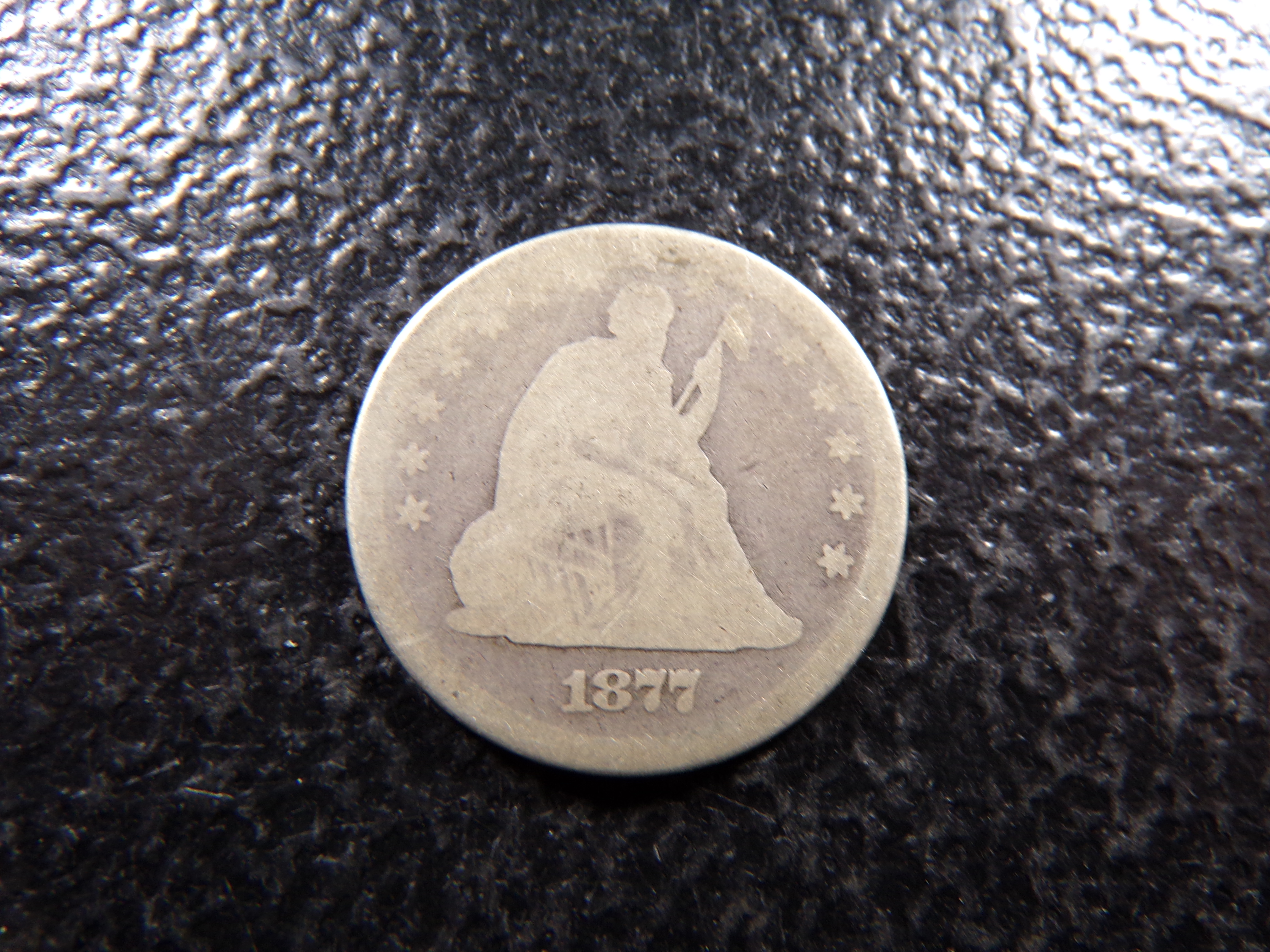 1877 SEATED LIBERTY SILVER QUARTER