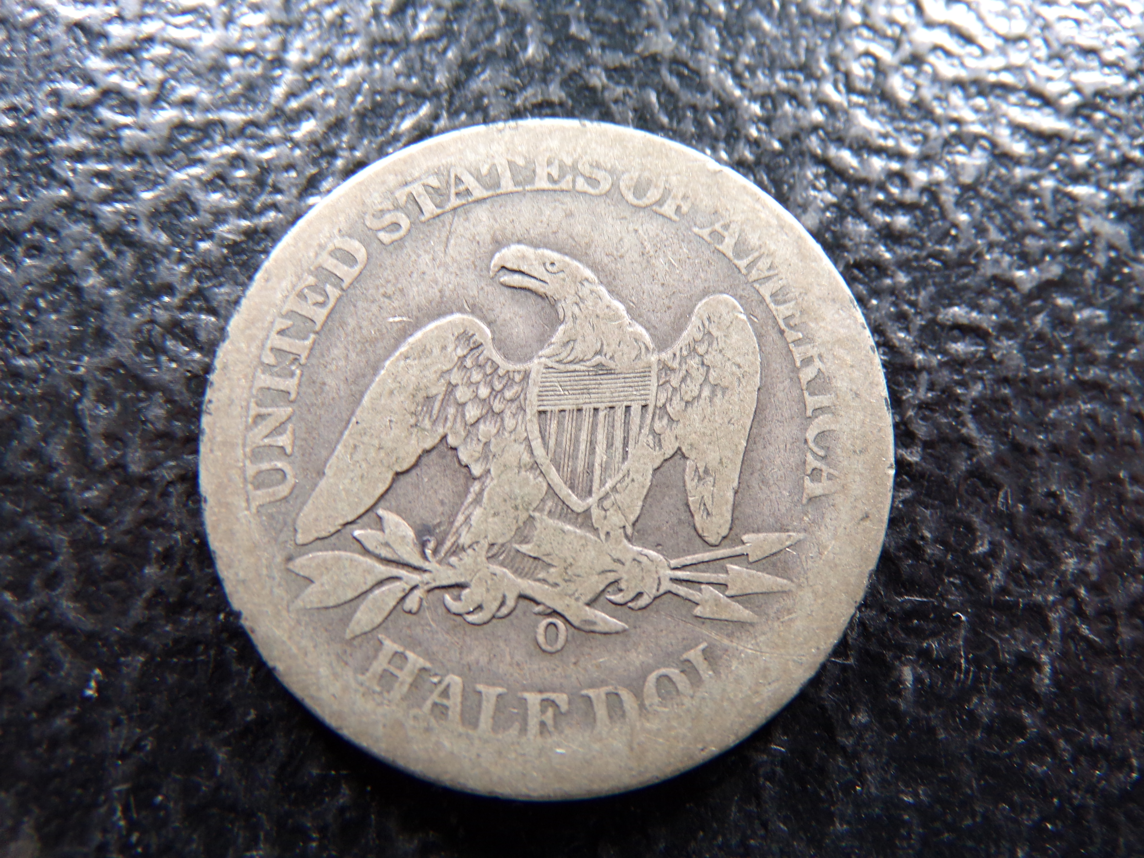 1860-O SEATED LIBERTY SILVER HALF DOLLAR