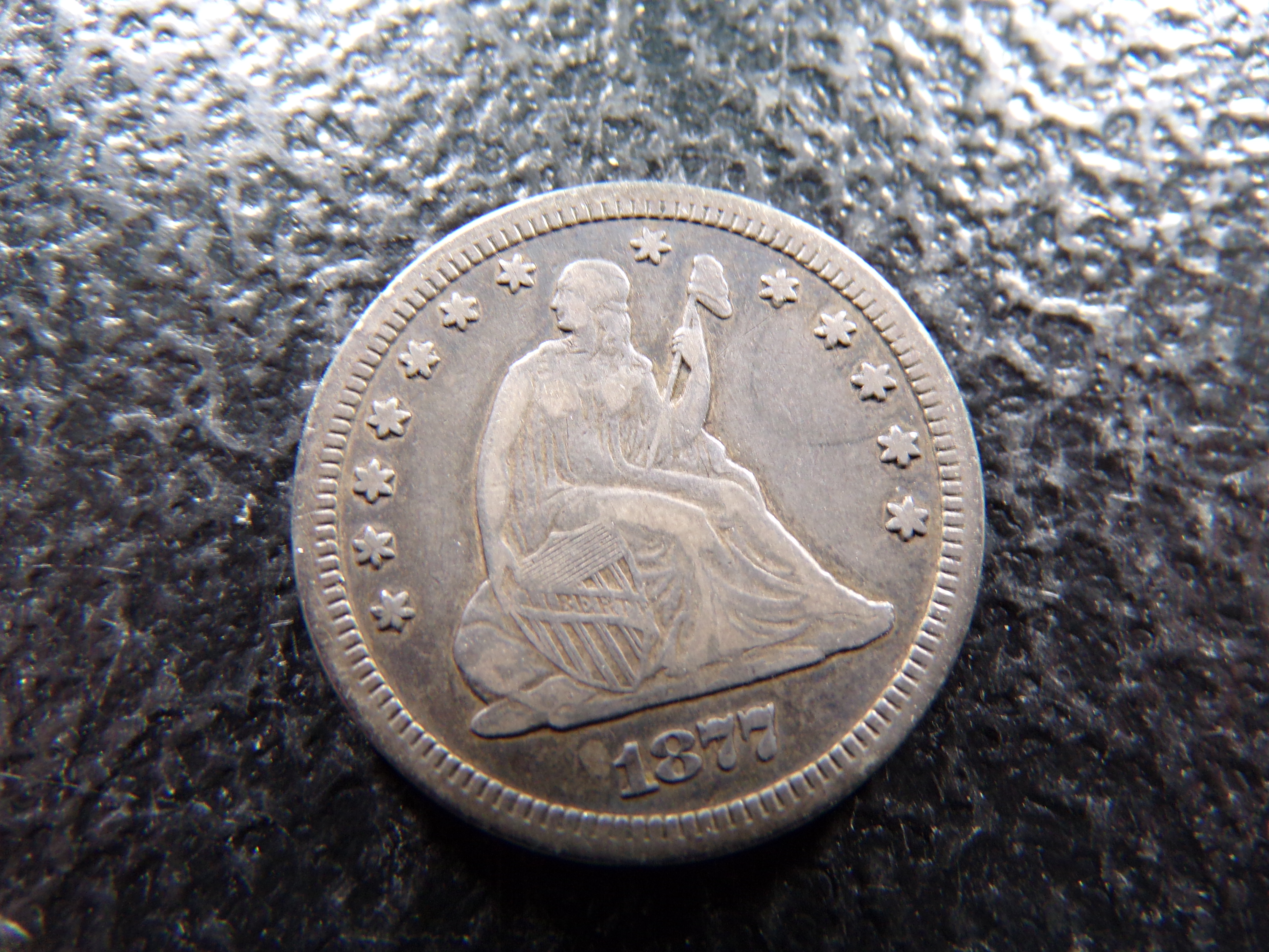 1877-CC CARSON CITY SEATED LIBERTY SILVER QUARTER