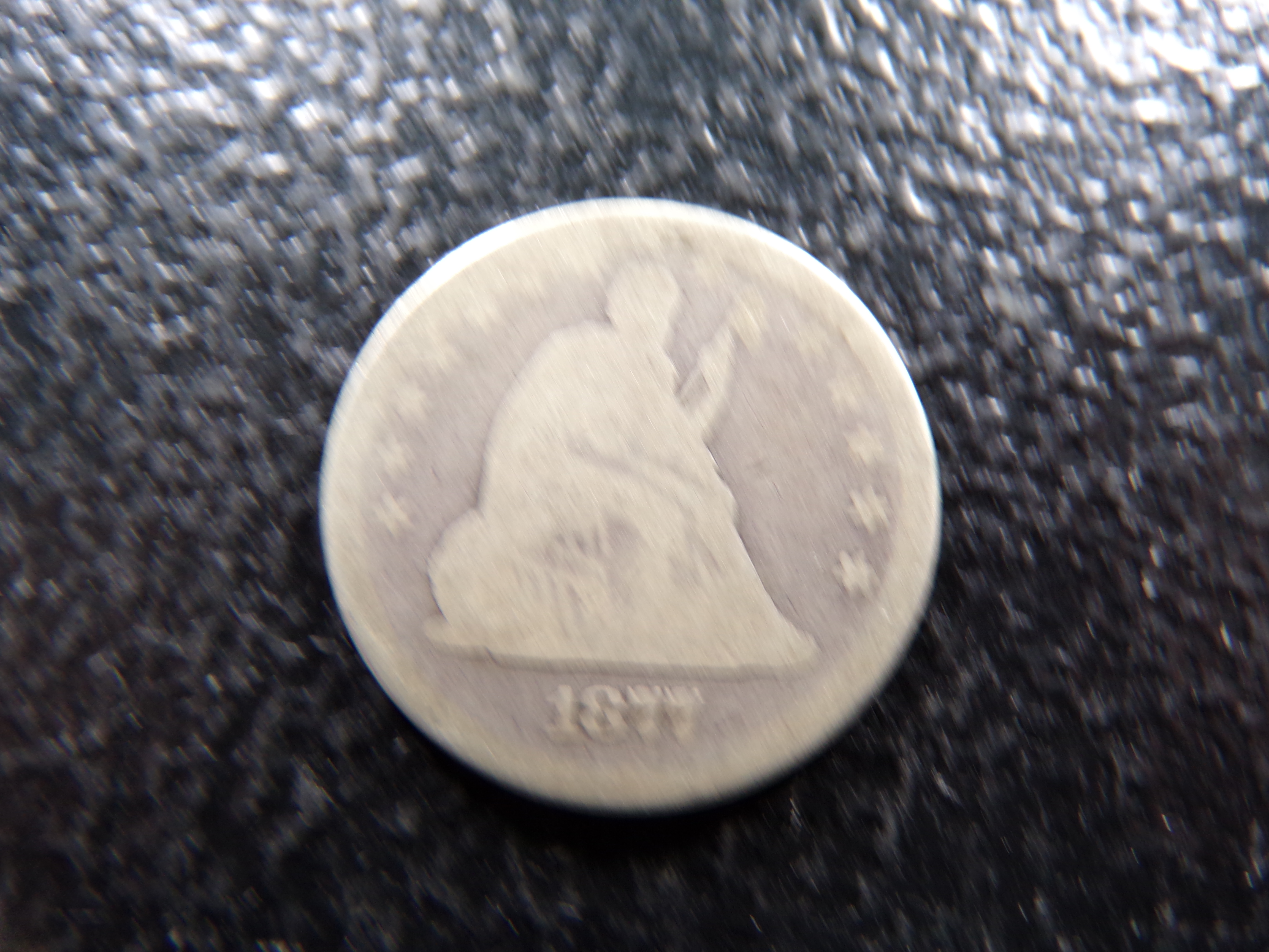 1877 SEATED LIBERTY SILVER QUARTER