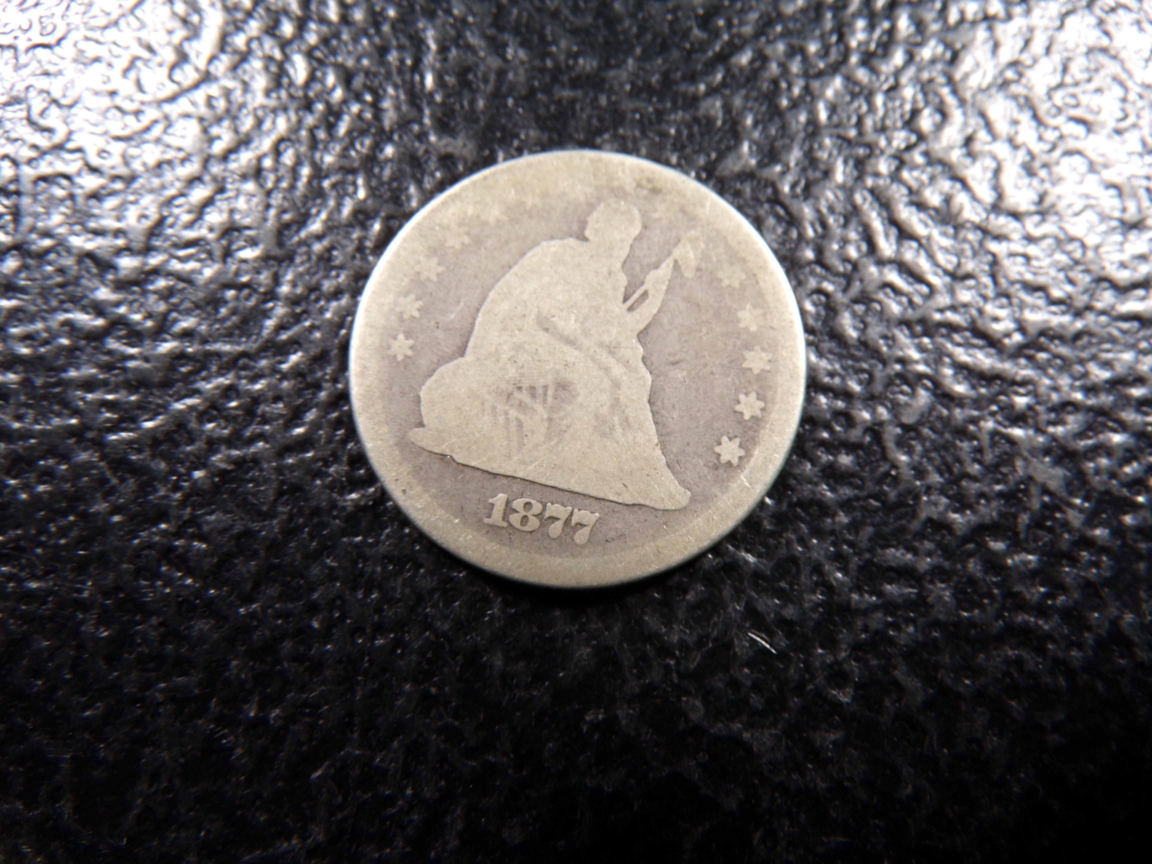 1877 SEATED LIBERTY SILVER QUARTER