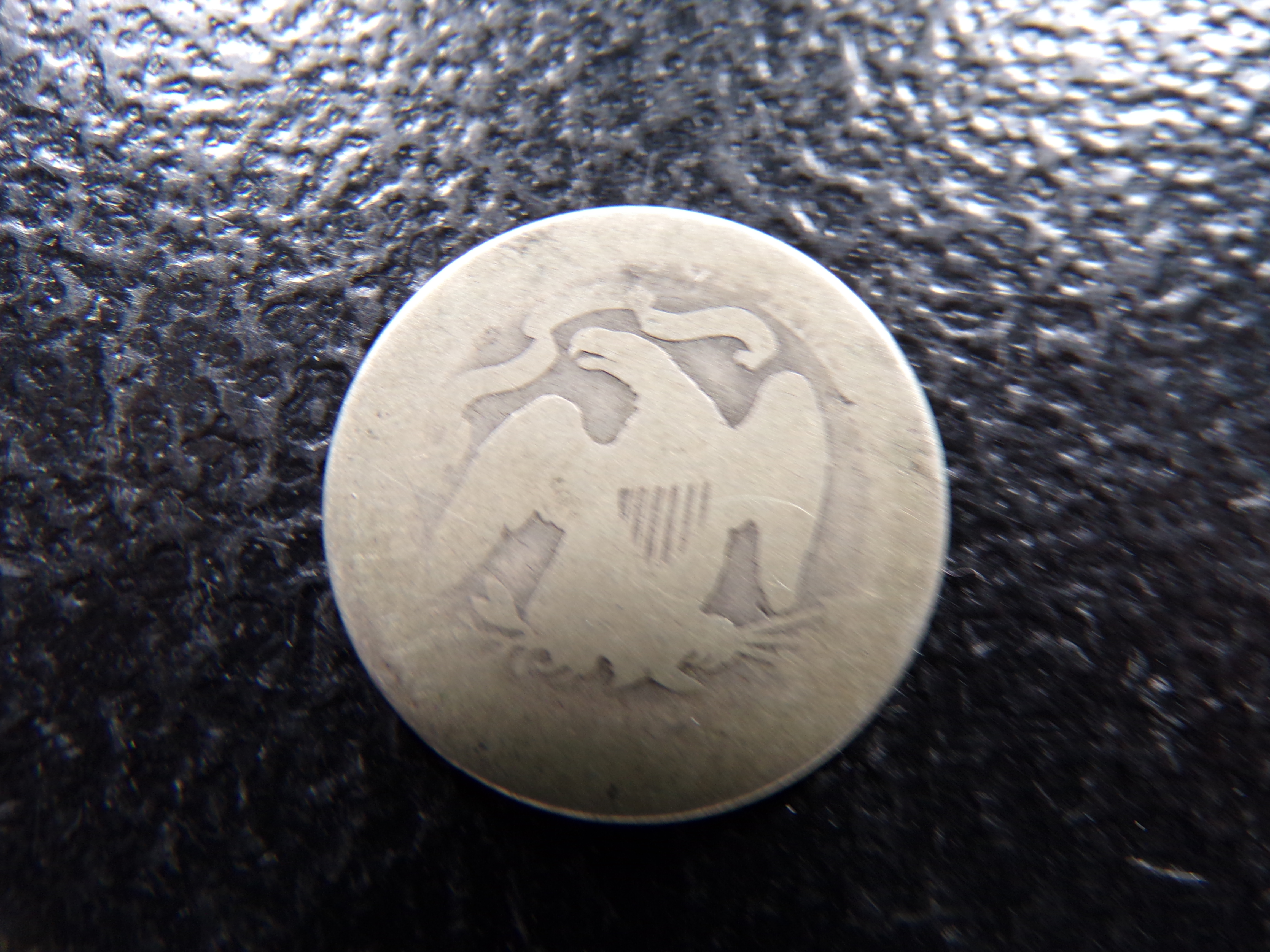 1877 SEATED LIBERTY SILVER QUARTER