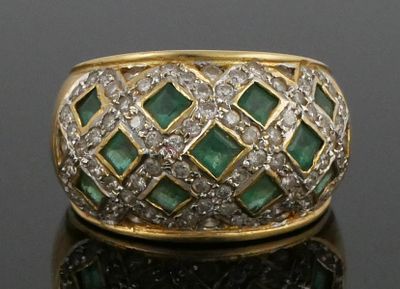 18K Gold Emerald Diamond Ring. 18 karat yellow gold wide band accented with emeralds and