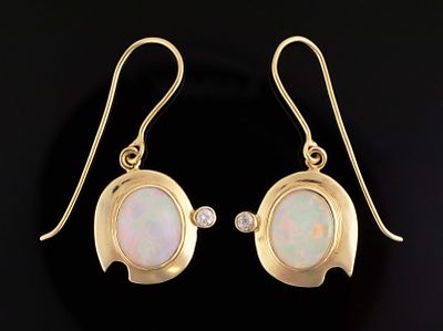 14K Gold Opal Diamond Earrings. 14 karat yellow gold earrings set with opal and diamonds. 
