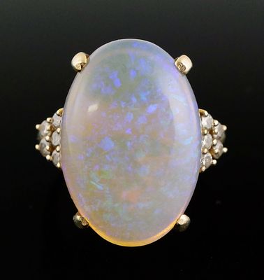 14K Gold Diamond Opal Ring. 14 karat yellow gold ring set with an opal and diamonds. Classic 