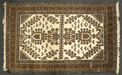 Afghan Wool Rug. Afghan hand-knotted wool rug featuring a cream field with symmetrical geometric 