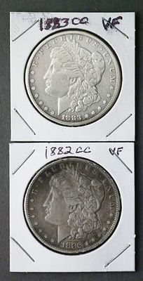 (2) Morgan Silver Dollars 1882CC 1883CC. Includes 1883-CC and 1882-CC Carson City issues. TAGS: 