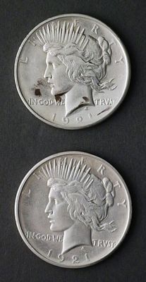 (2) 1921 High Relief Peace Silver Dollars. Two 1921 high relief silver Peace dollars. TAGS: low 