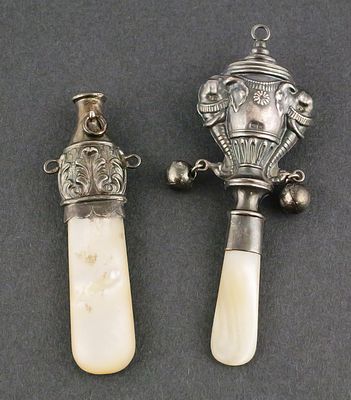 Two Birmingham Sterling Silver Rattles. One with elephants and urn design, 1861 date mark 