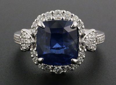 Platinum Sapphire and Diamond Ring. Main Gemstone: Sapphire, Cushion shape, Modified Brilliant 