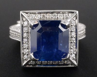 18K Gold Sapphire & Diamond Ring. 18K white gold ring set with one octagonal step-cut natural 
