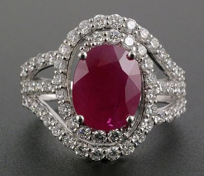 Platinum Burma Ruby Diamond Ring. Platinum ring set with one 3.00 ct natural Burma ruby and 48 