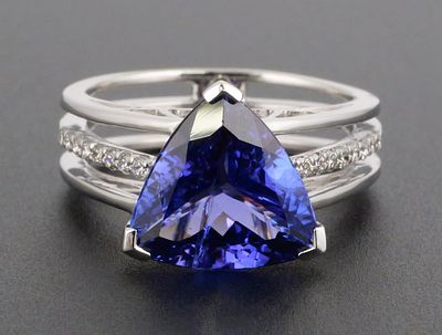 14K Gold Tanzanite & Diamond Ring. 14K white gold ring set with one triangular brilliant-cut 