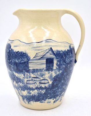 Michael & Melvin Crocker Folk Art Pottery Pitcher. Hand painted scene of barn in blue, signed on 