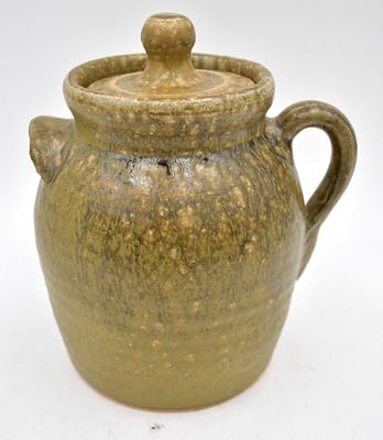 John Meaders Stoneware Lidded Storage Jar. 7 inches by 6.5 inches, double handled with one ear 