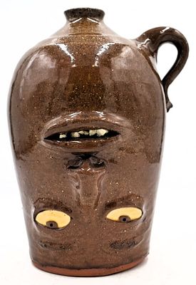 Charlie West Folk Art Pottery Upside Down Face Jug. 9.25 inches by 6.25 inches, signed and dated 