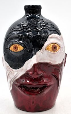 Charlie West Patriot Glazed Face Jug. 11.5 inches tall by 7 inches wide, red white and blue 