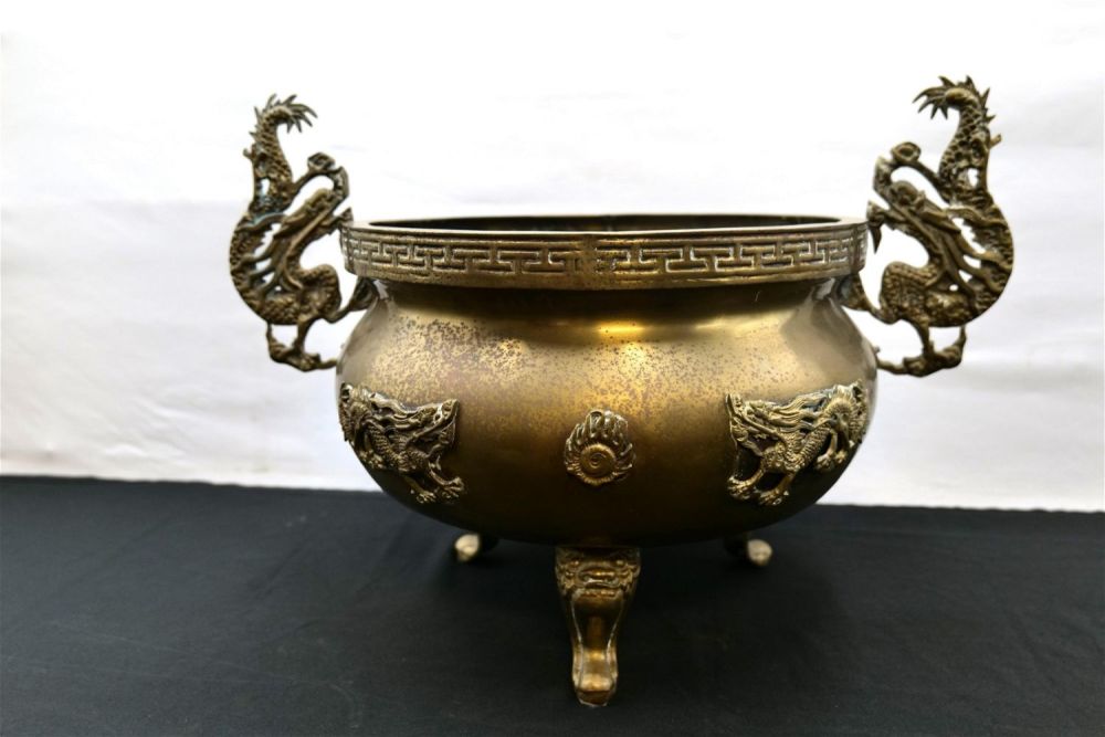 Lot 154: Brass double handled and footed floor vase